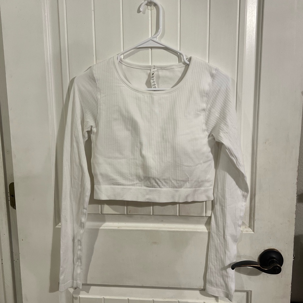 Lululemon cropped long sleeve top - size 8. Built in padded bra! Only wore once